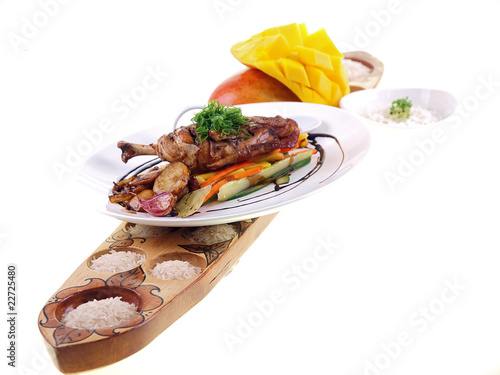 fried chicken adobo, rice and fresh mango isolated on white photo