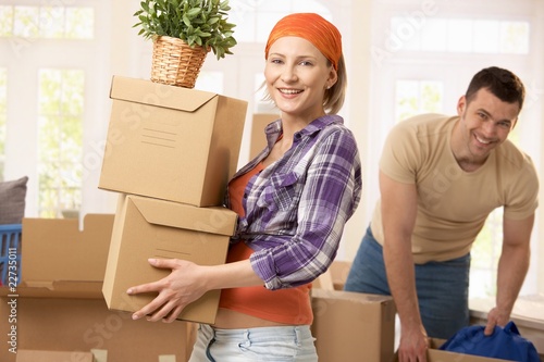 Happy couple moving house photo