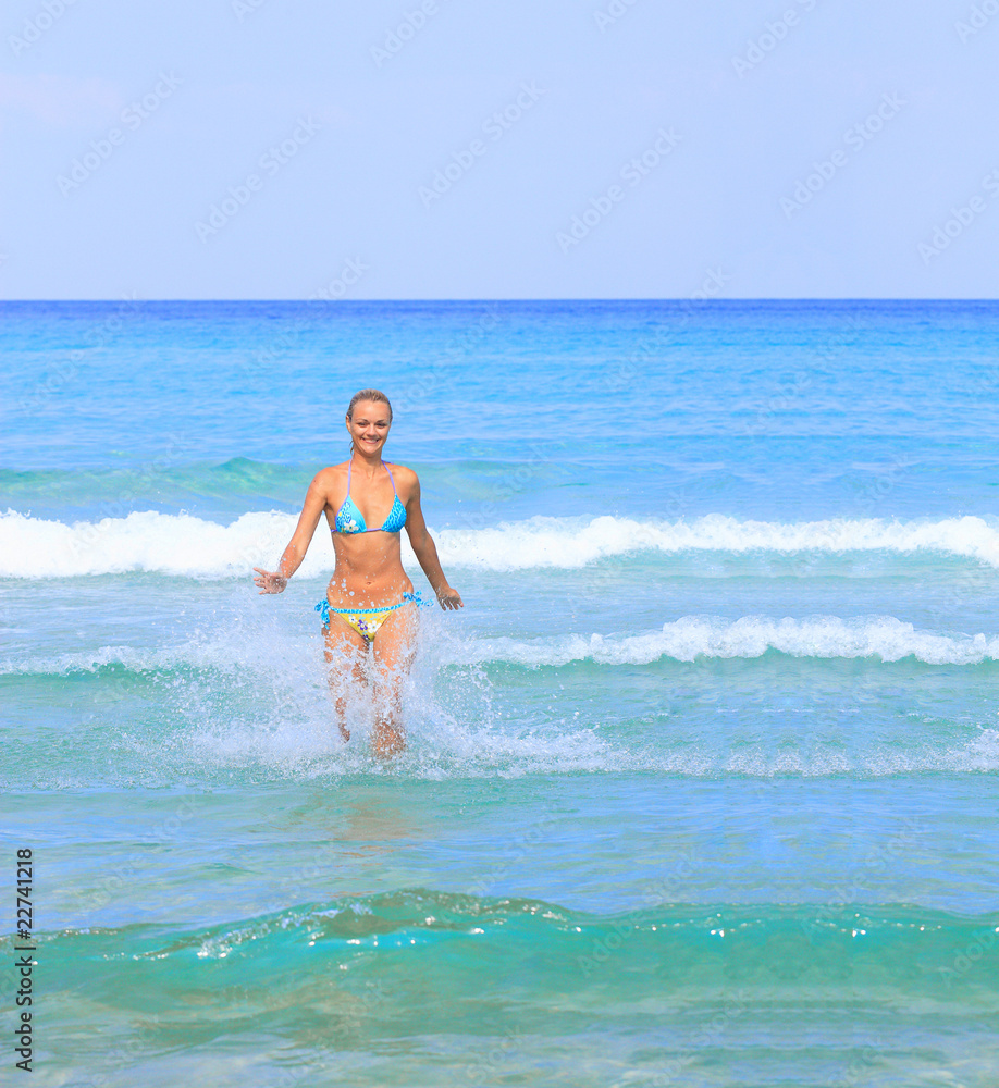 tanned woman in bikini in the sea