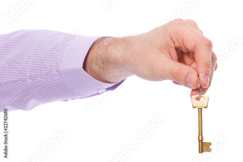 hand holds house door key