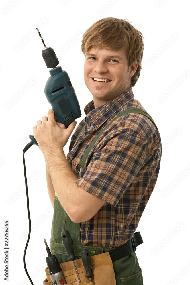 Happy handyman posing with power drill Happy handyman posing with power drill