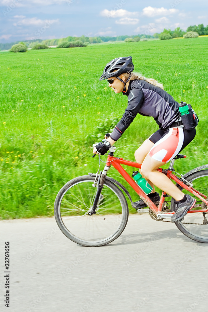 Young woman riding a mountain bike Young woman riding a mountain bike