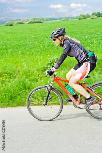 Young woman riding a mountain bike