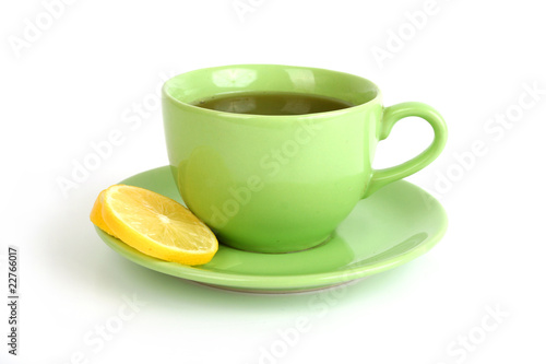 Cup of tea with lemons and lumps of sugar