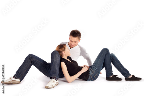 Casual Couple Lying Down on White