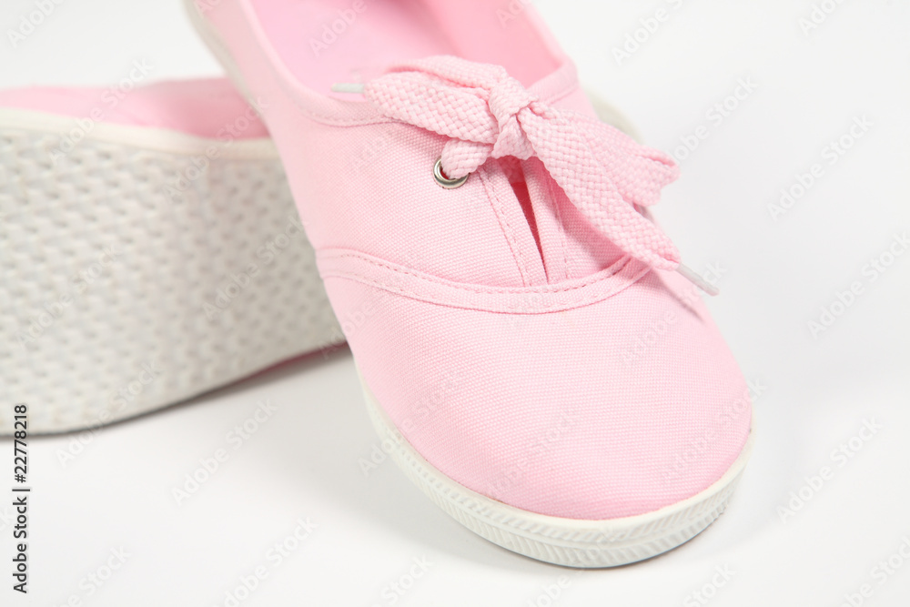 a pair of pink women shoes and white background a pair of pink women shoes and white background