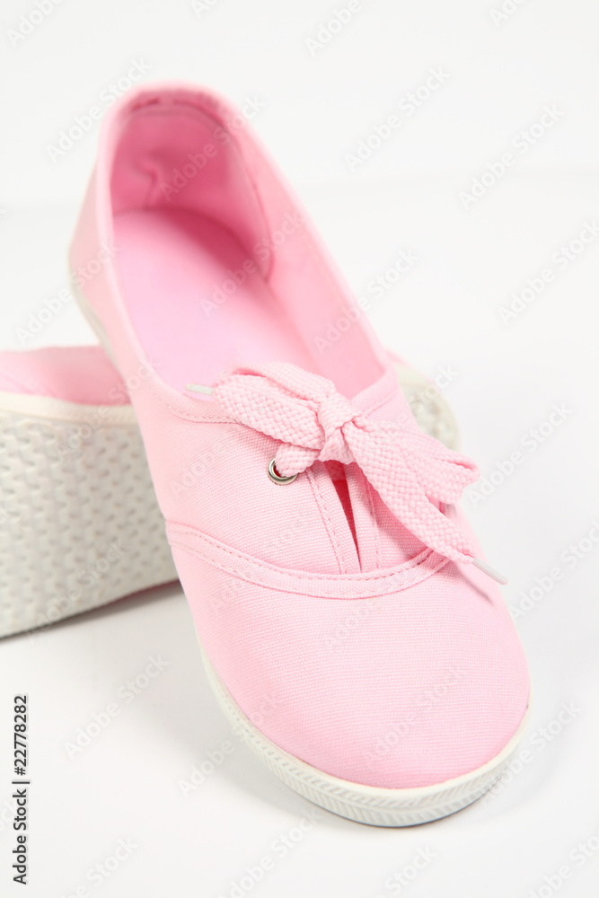 a pair of pink women shoes and white background a pair of pink women shoes and white background