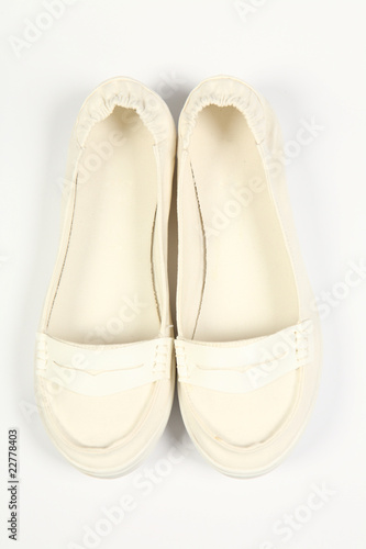 a pair of white women shoes and white background
