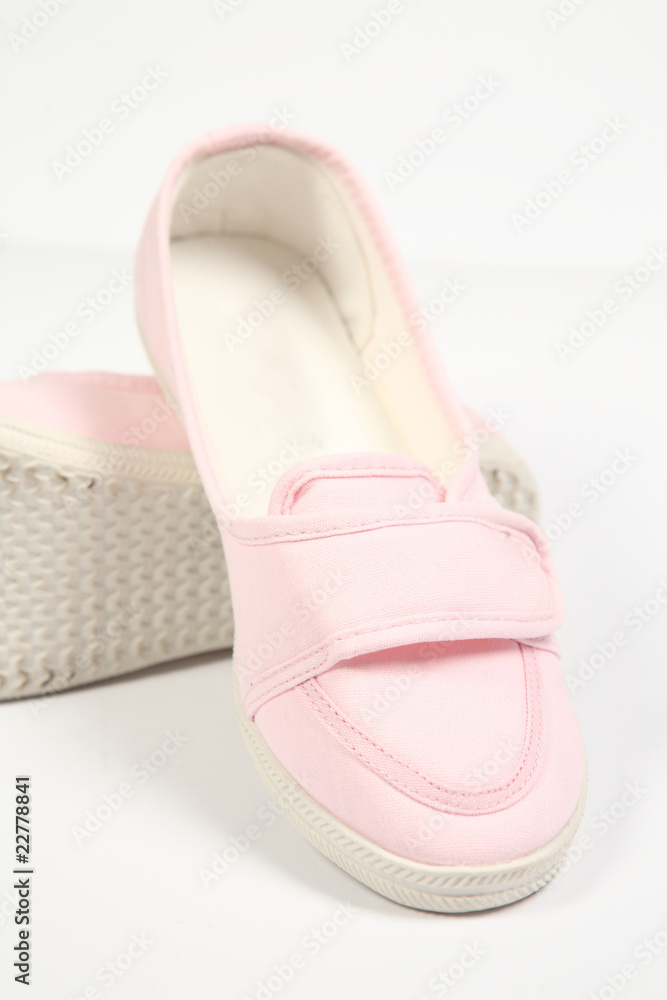 a pair of pink women shoes and white background a pair of pink women shoes and white background