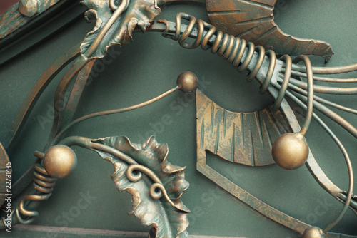 decorative wrought iron in form of leaves with golden pearls