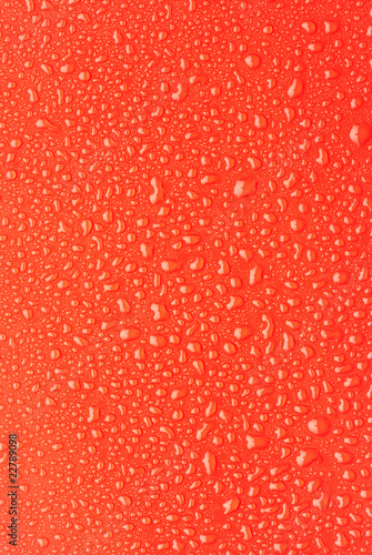 Rain droplets on a red plastic