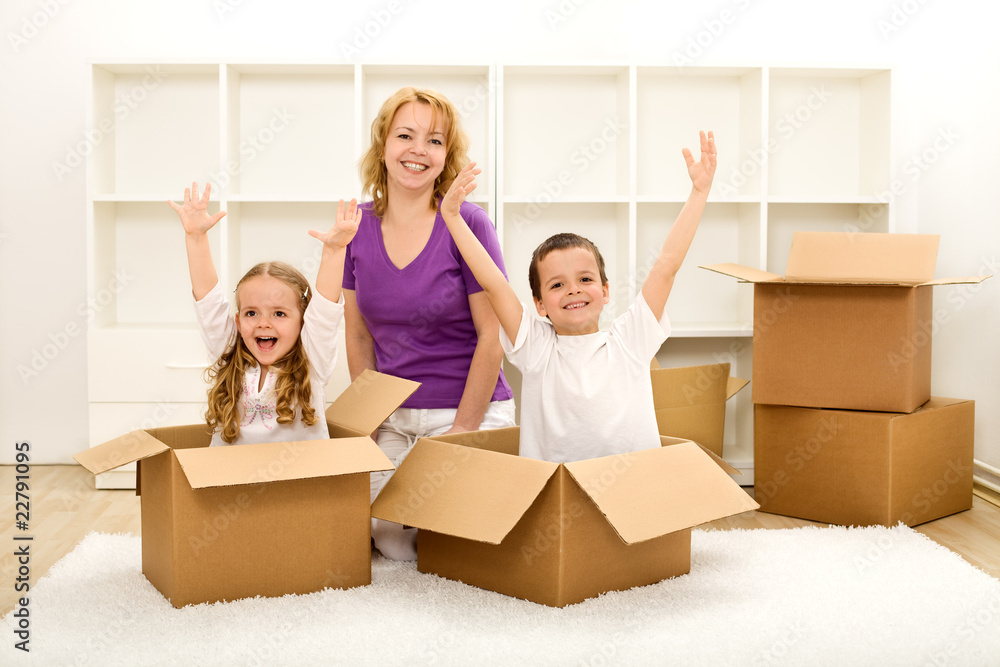 Happy people moving in a new home Happy people moving in a new home