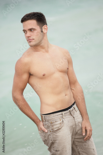 Shirtless man on the beach