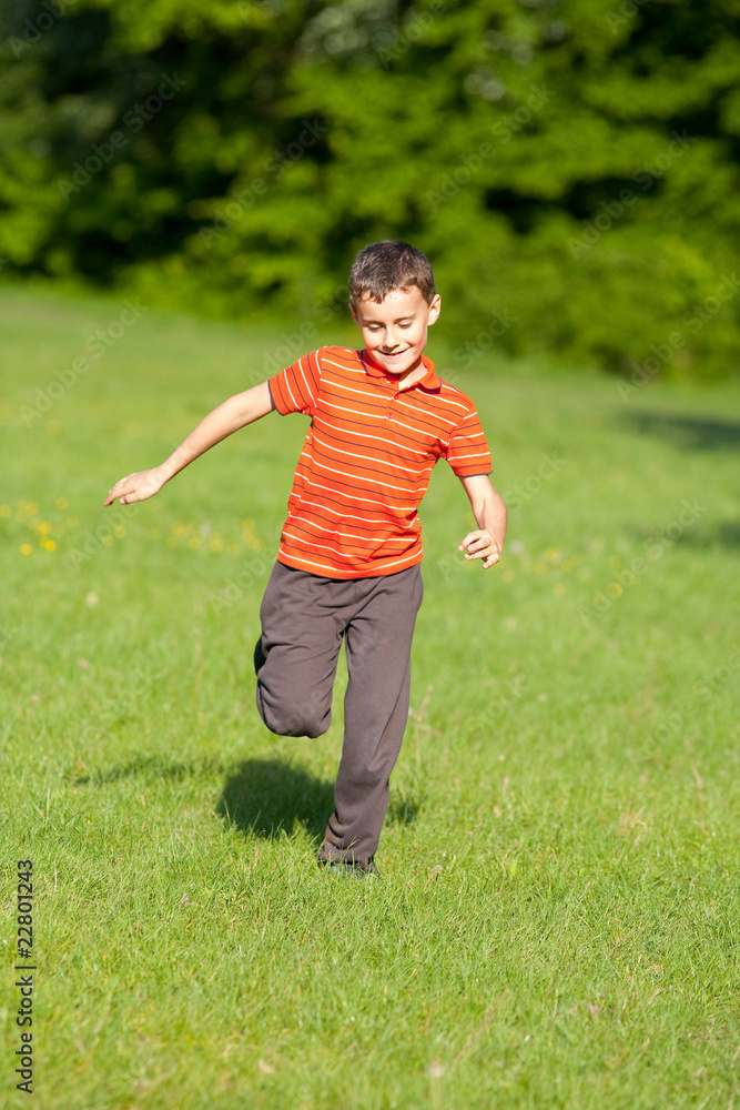 Cute kid running on grass Cute kid running on grass