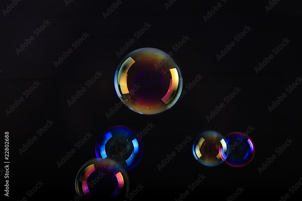 Soap bubbles on black background . Soap bubbles on black background .