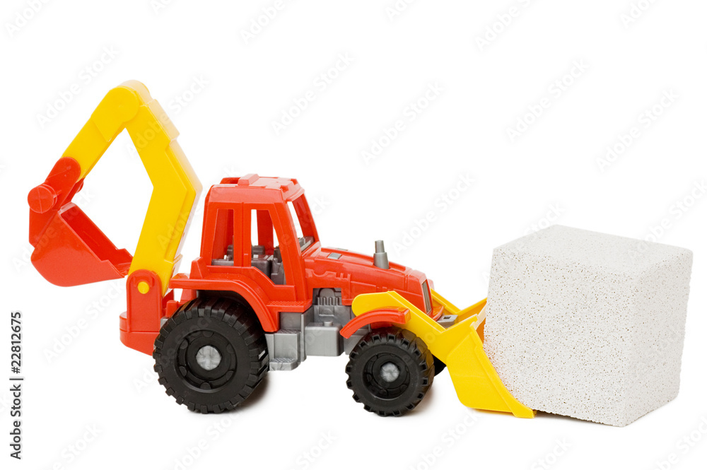 Toy tractor and the block isolated