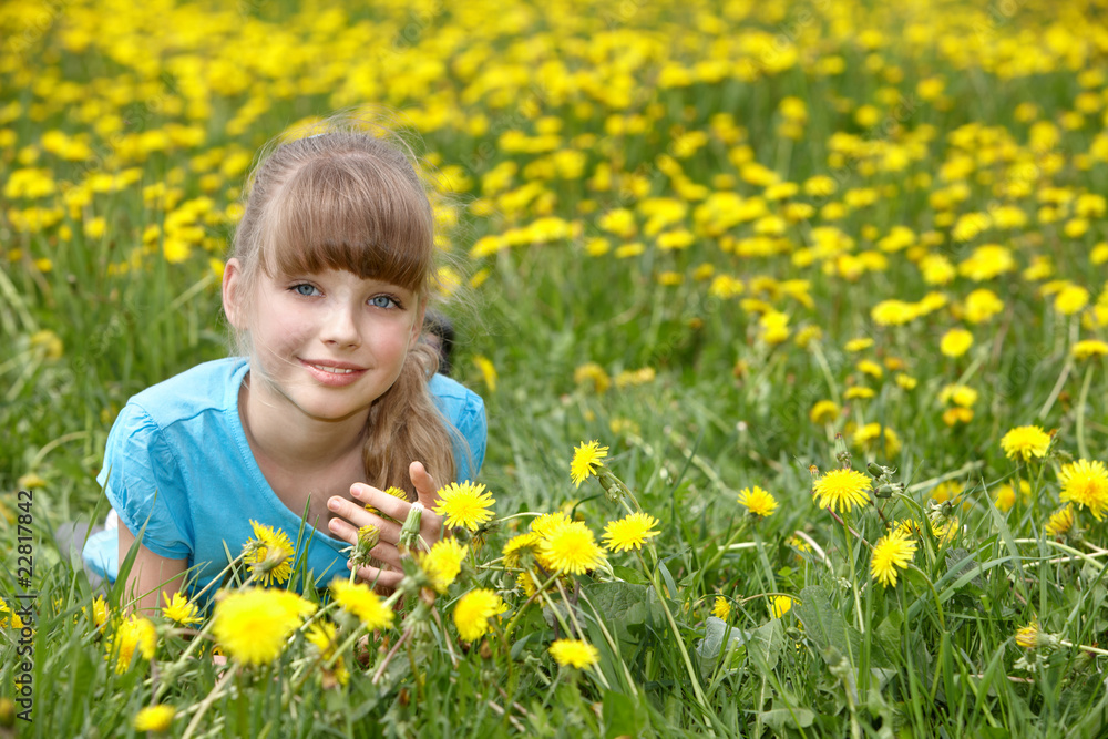 Little girl lying on grass in flower. Little girl lying on grass in flower.