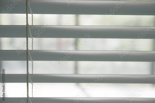 A photo of blinds as a background.