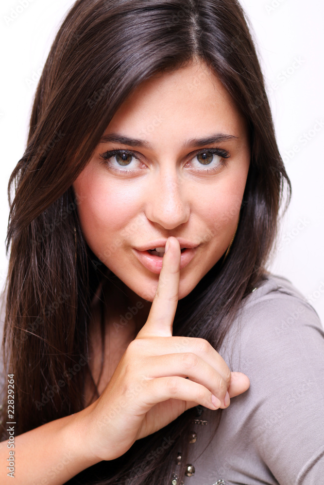 woman with silence sign isolated on white background woman with silence sign isolated on white background