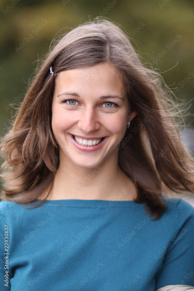 Closeup portrait of a happy young woman smiling