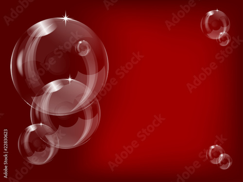 A series of transparent bubbles  on a red  background
