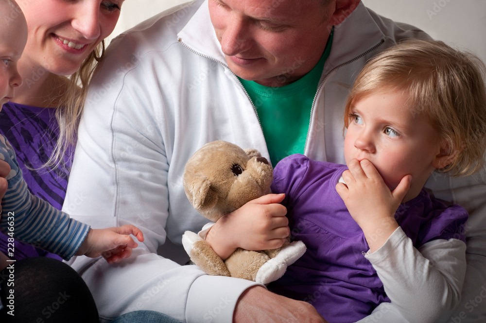 Close up of a little girl and her family