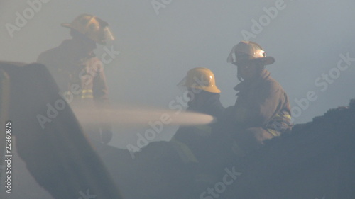 Fireman fighting fire in house