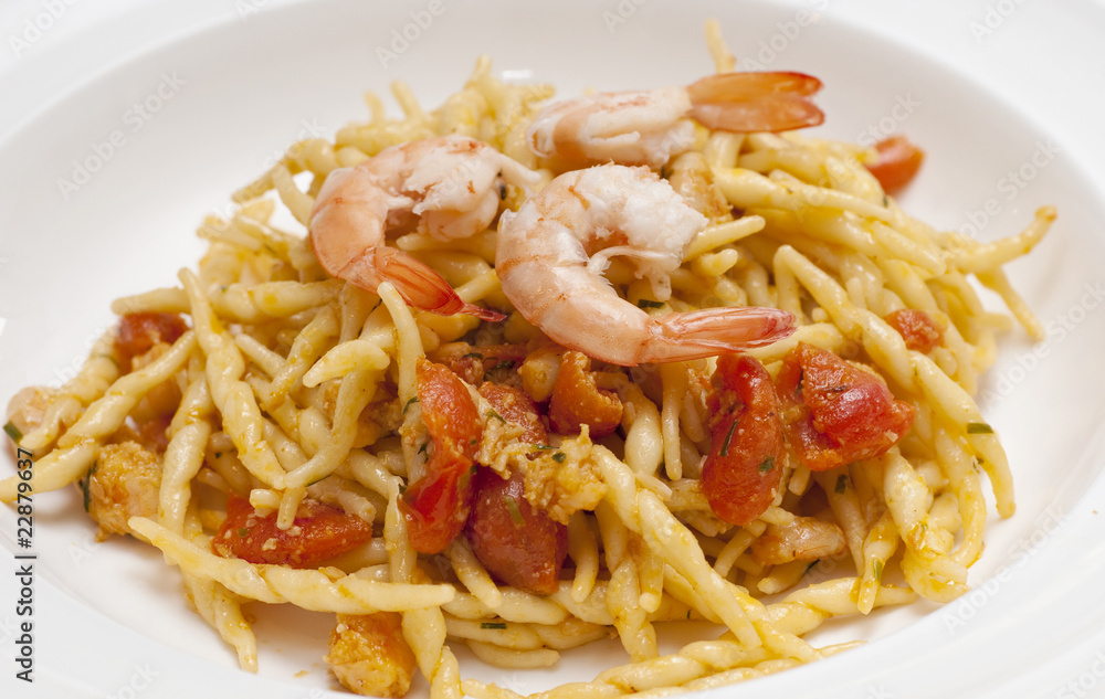 dish of pasta with a tomatoe shrimp sauce dish of pasta with a tomatoe shrimp sauce