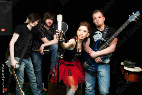 Group of rock musicians with musical instruments