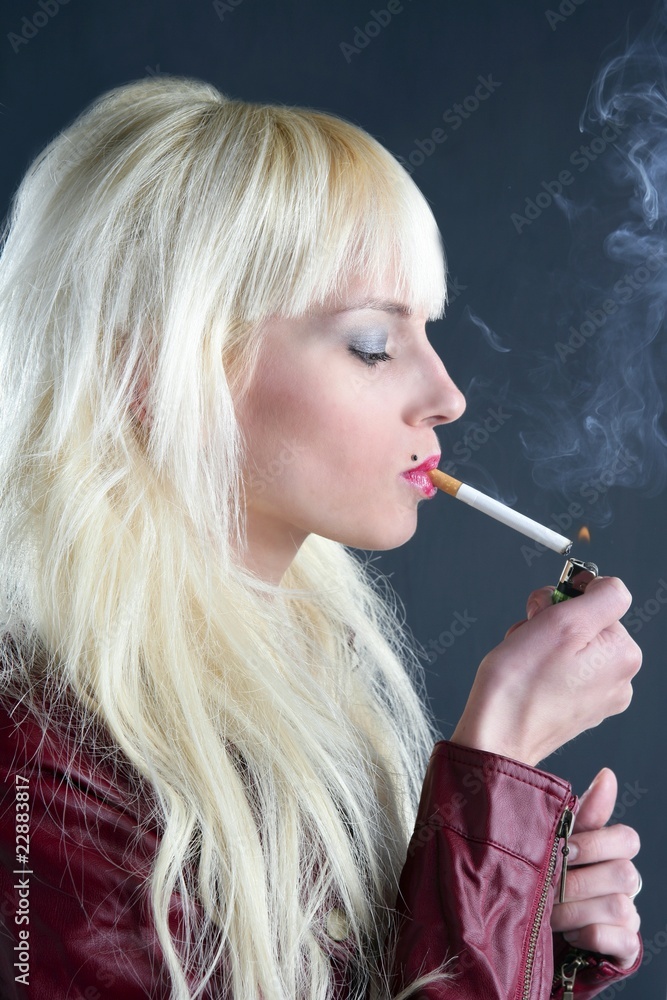 Fototapeta premium blonde smoking cigarette young fashion girl gray background