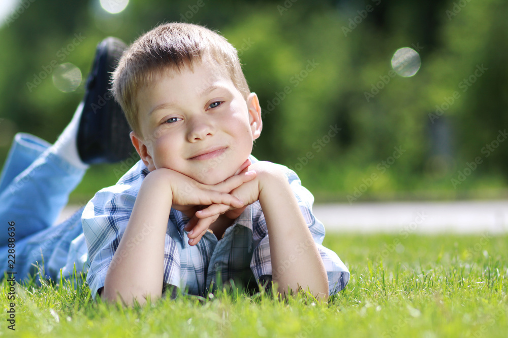 5 years old child lying on the grass. 5 years old child lying on the grass.