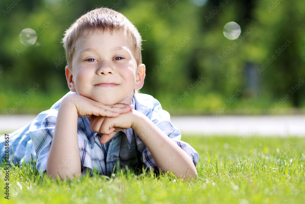 5 years old child lying on the grass. 5 years old child lying on the grass.