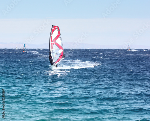 Windsurfers on the blue sea