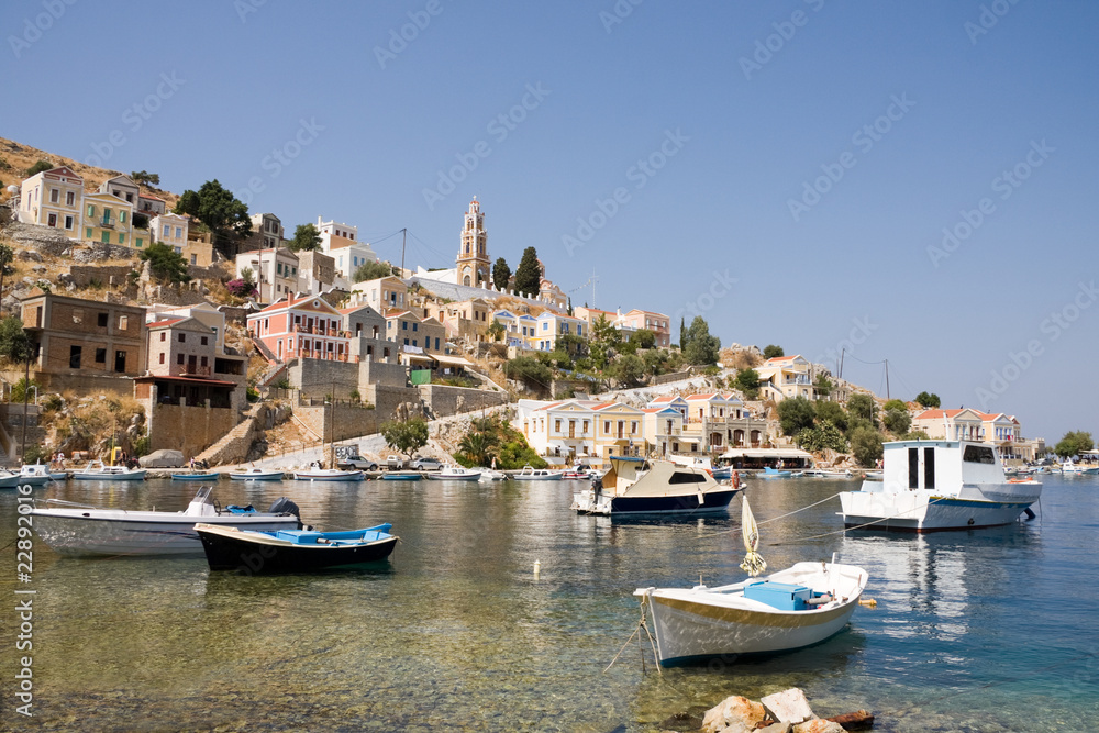 Small boats in bay of Symi island, Greece.