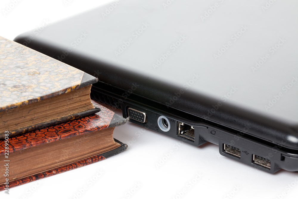 old books and laptop old books and laptop