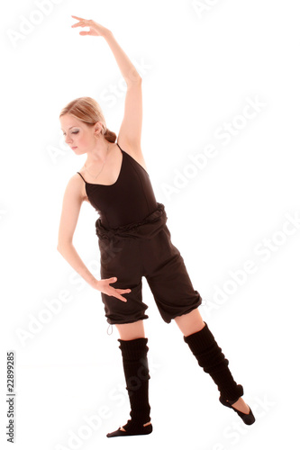 Young woman makes dancing exercise isolated on white