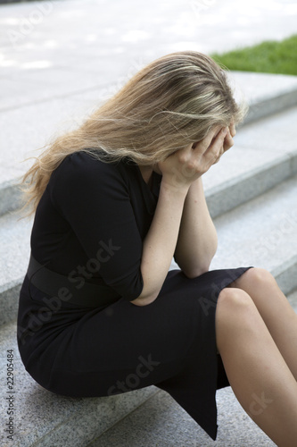 Depressed teen girl sitting on stairs © elenarostunova