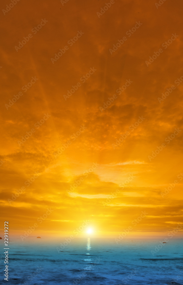 orange sunset above blue sea