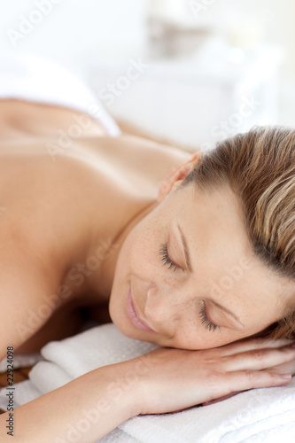 Close-up of a young woman having a massage with stones