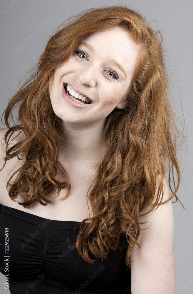 Fototapeta premium Beautiful Red Headed Girl Smiling