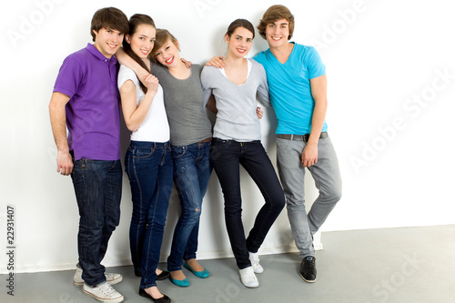 Five young friends standing together