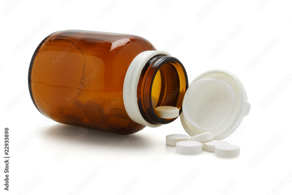 Open glass bottle and spliied tablets Open glass bottle and spliied tablets