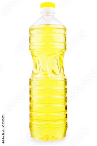 Bottle with yellow liquid isolated on white background photo