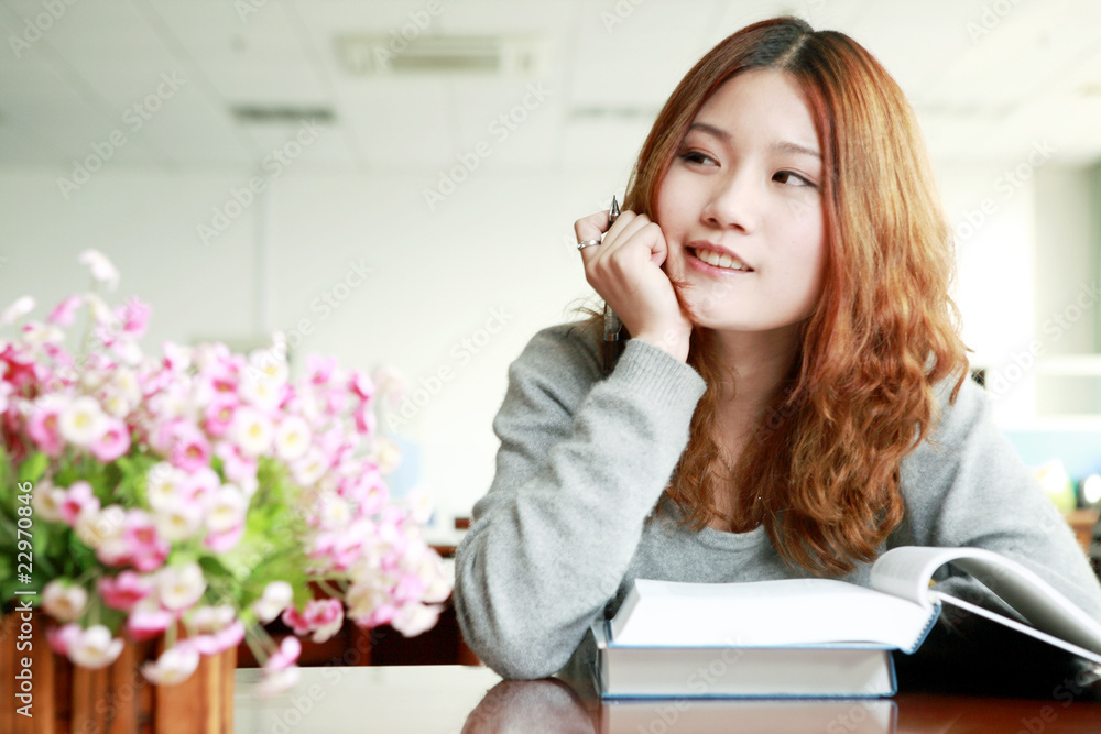 asian girl studying in library