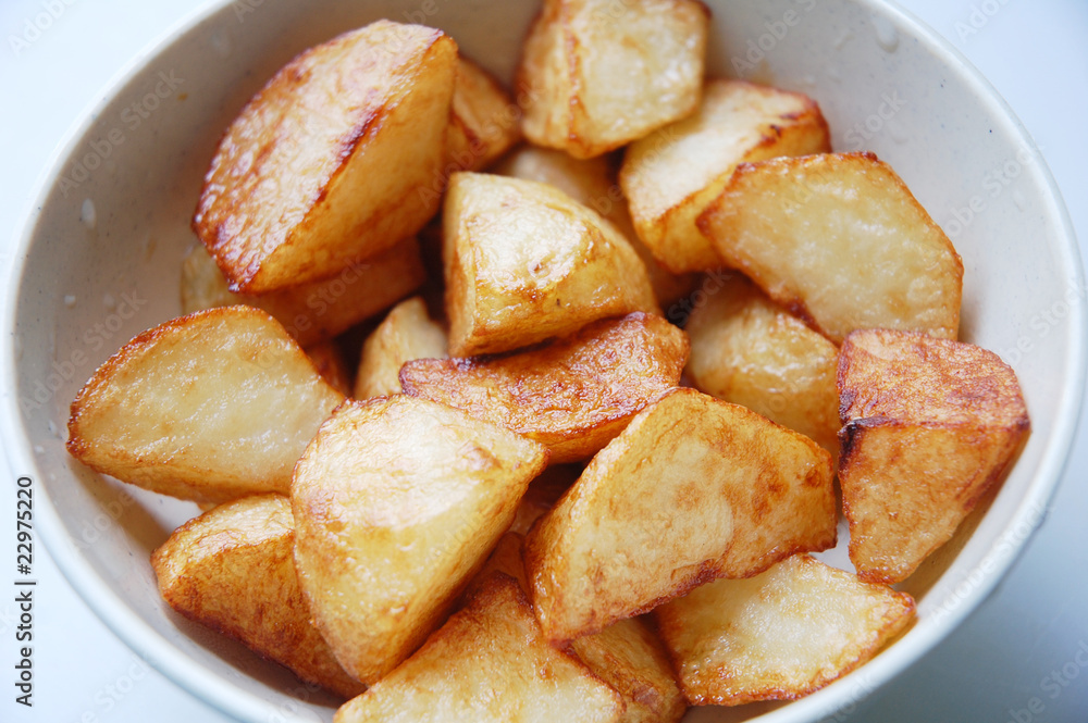 close up of fried potato with white as background close up of fried potato with white as background