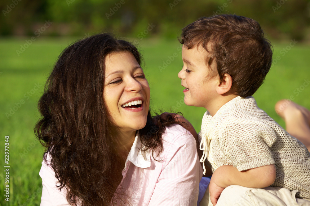 mother playing with her son outdoor