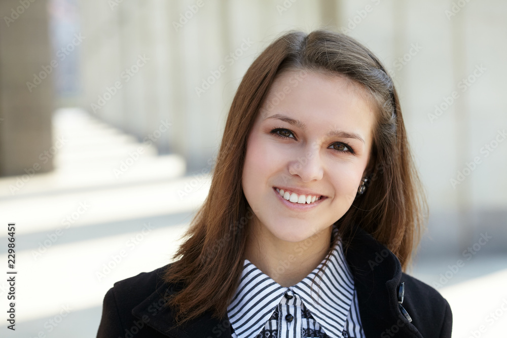 Fototapeta premium beautiful young girl near library