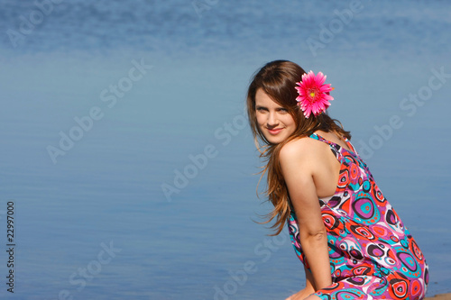 young beautiful girl on sea background