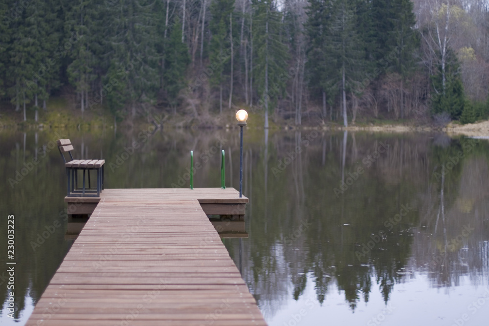 Footway, bench and light on small lake Footway, bench and light on small lake