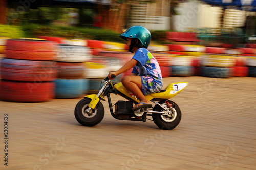 kid riding a motorcycle © Kamorn